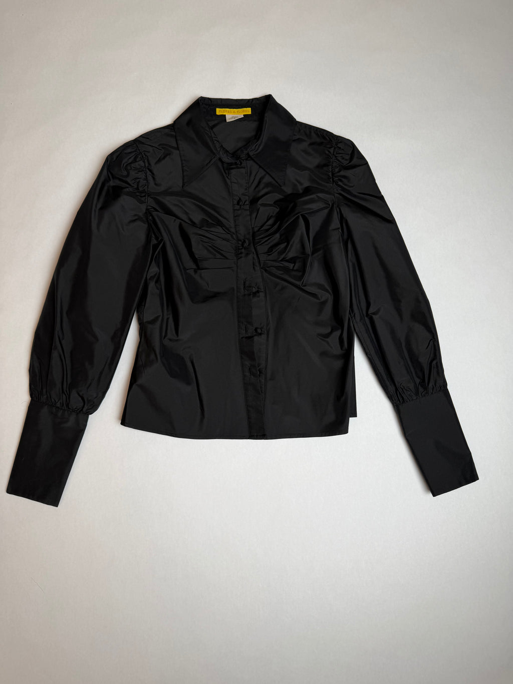 Flores & Flores black silk blouse with puff sleeves