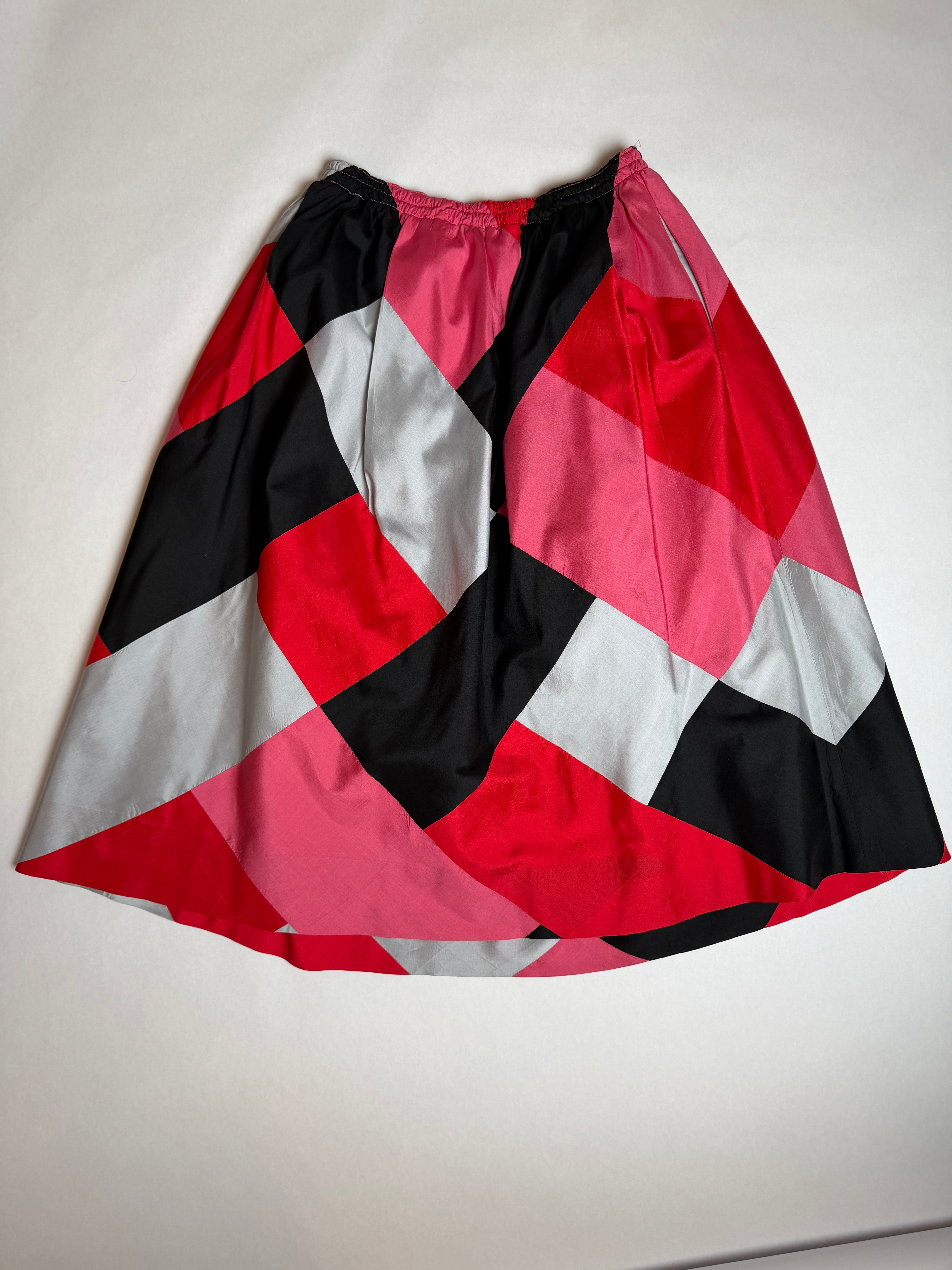 Fine Feathers color-block silk skirt in red, pink, ivory, and black