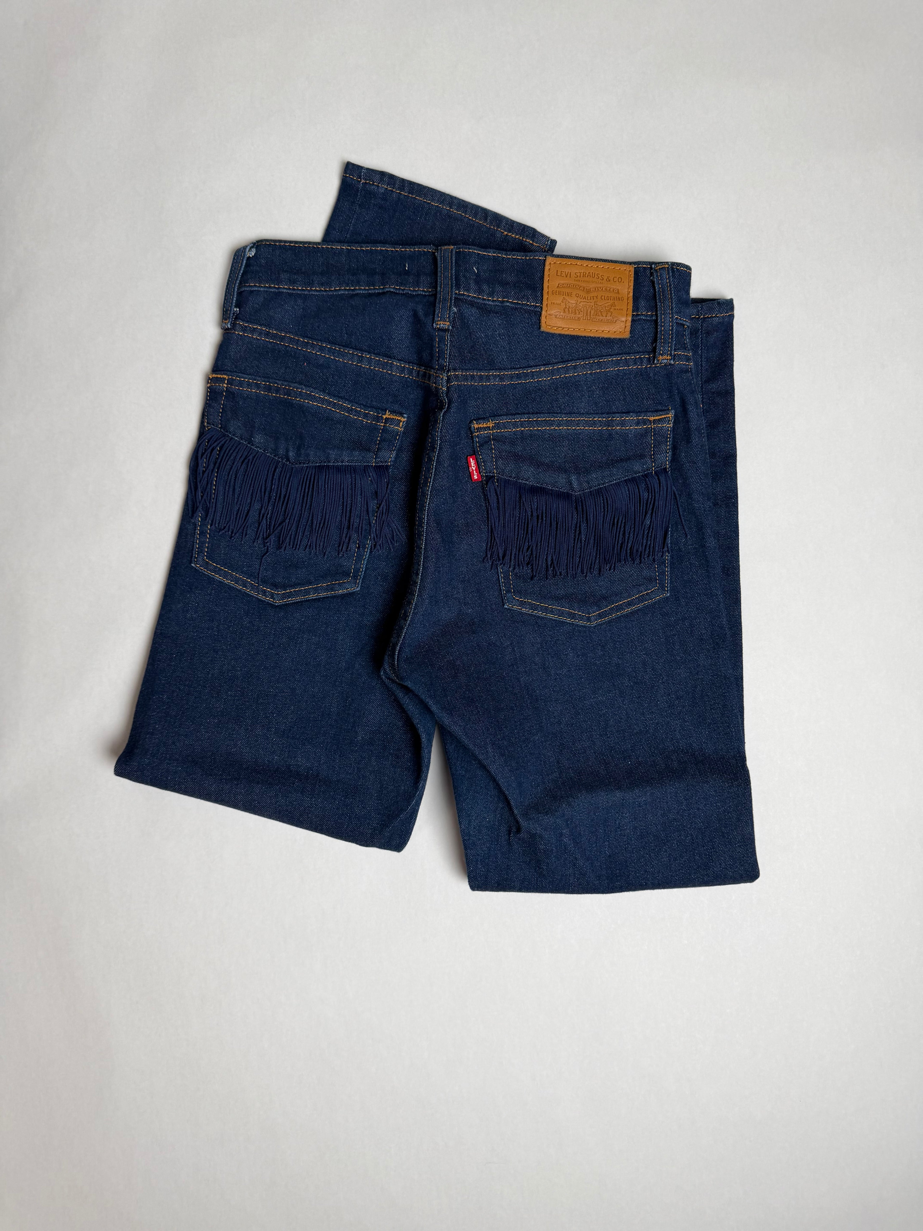 Levi's Premium Wedgie Straight dark indigo jeans — back fringe pocket detail